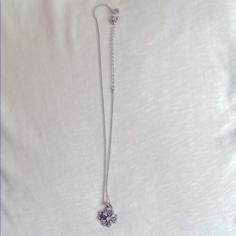 Necklace with stone flower pendant